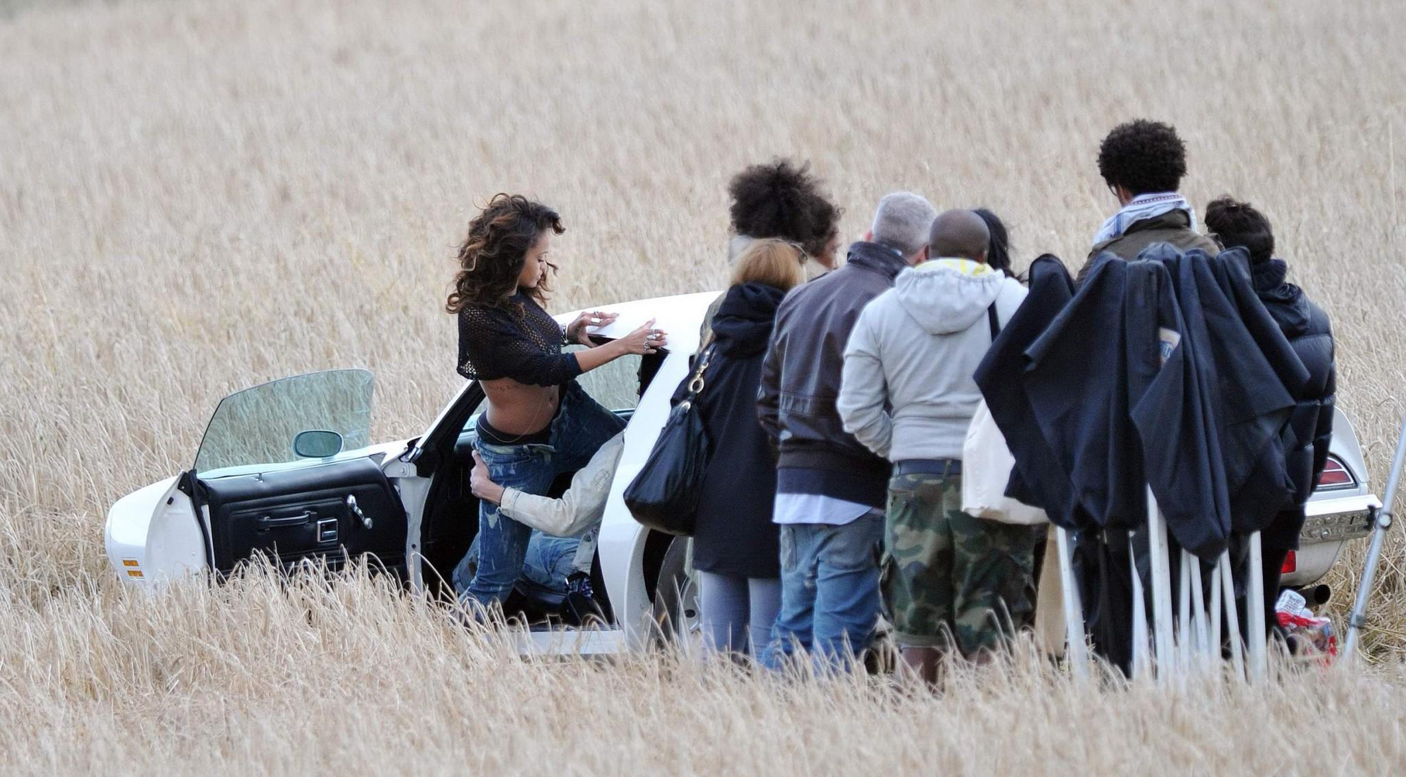 16P Rihanna braless in see through top shooting a music video in Ireland