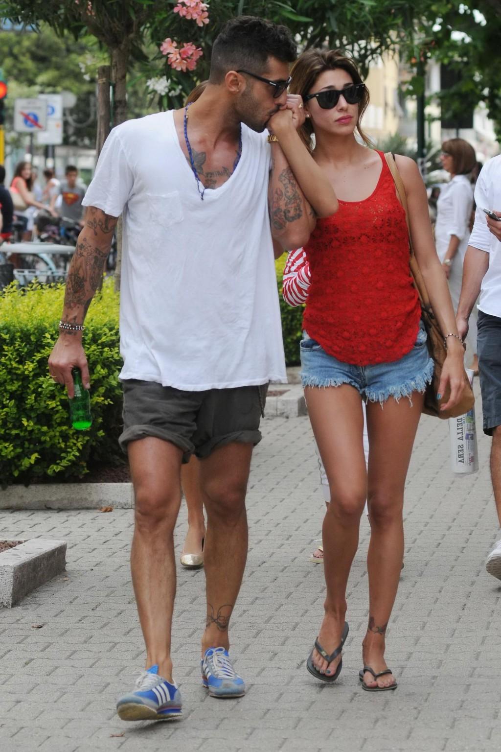 16P Belen Rodriguez shows off her ass wearing thong bikini on a beach in Forte Dei M