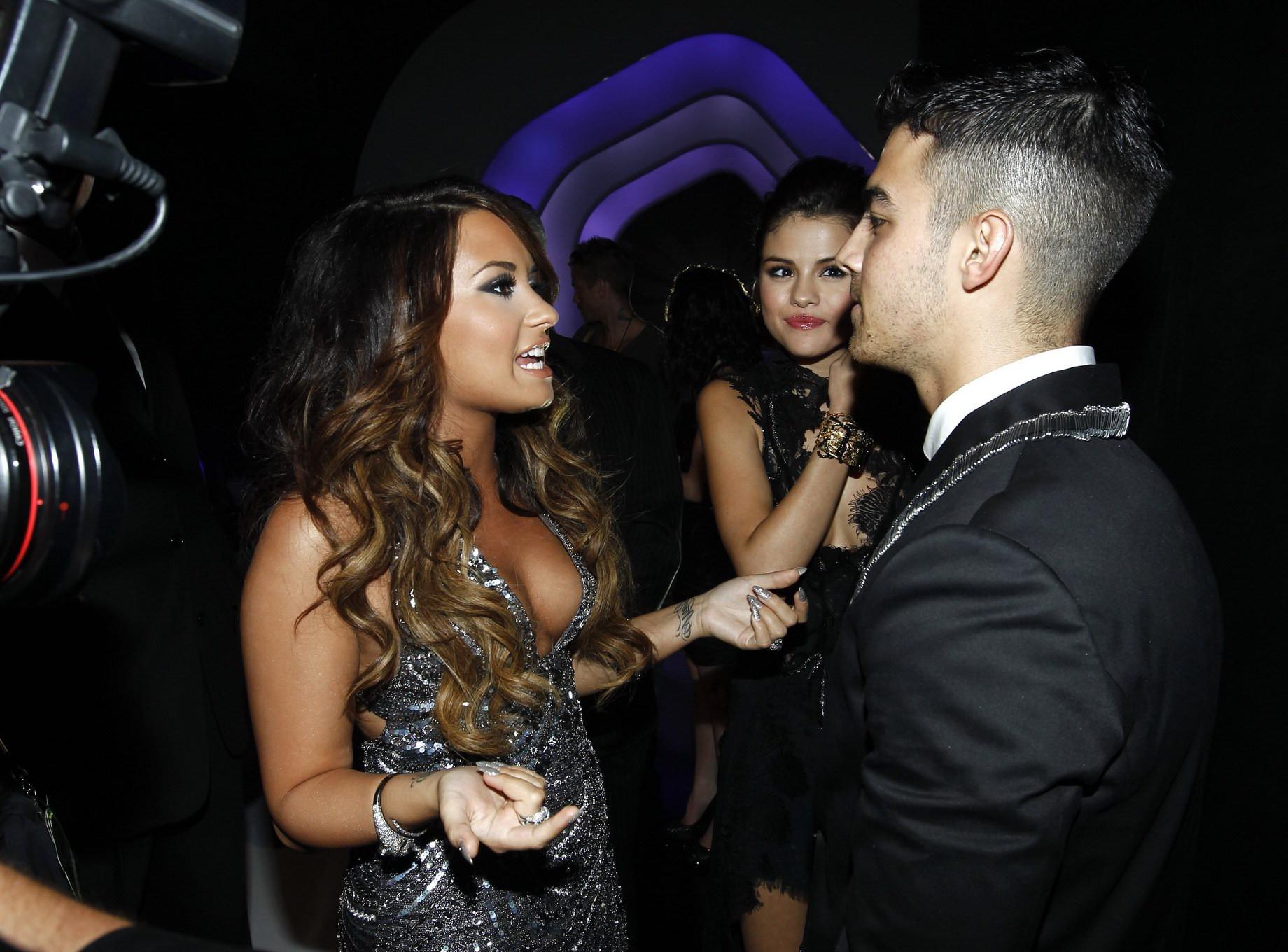 16P Demi Lovato showing side-boob at the 2011 MTV Video Music Awards in LA