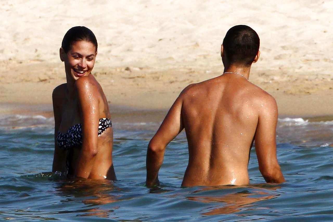 16P Melissa Satta showing her fantastic ass in thong bikini on beach paparazzi pictu