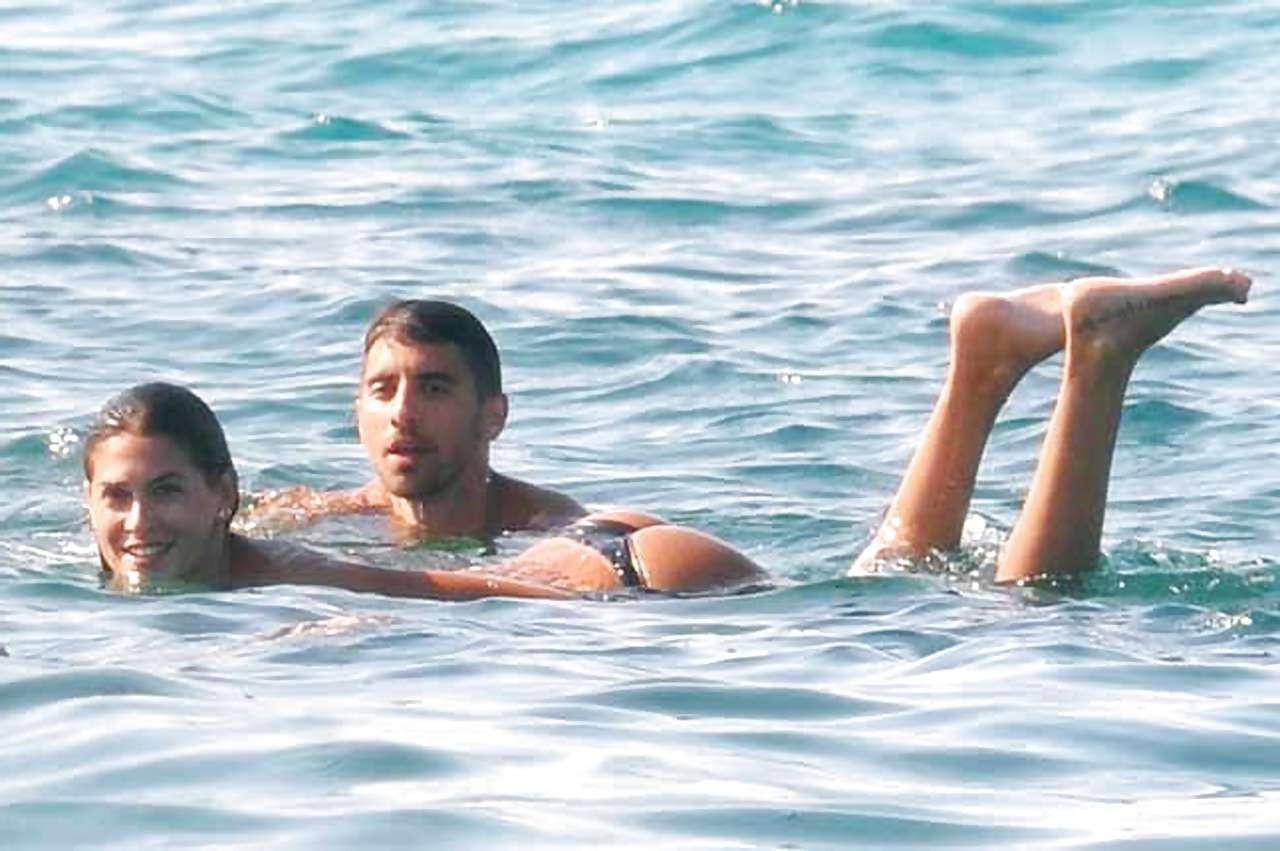 16P Melissa Satta showing her fantastic ass in thong bikini on beach paparazzi pictu