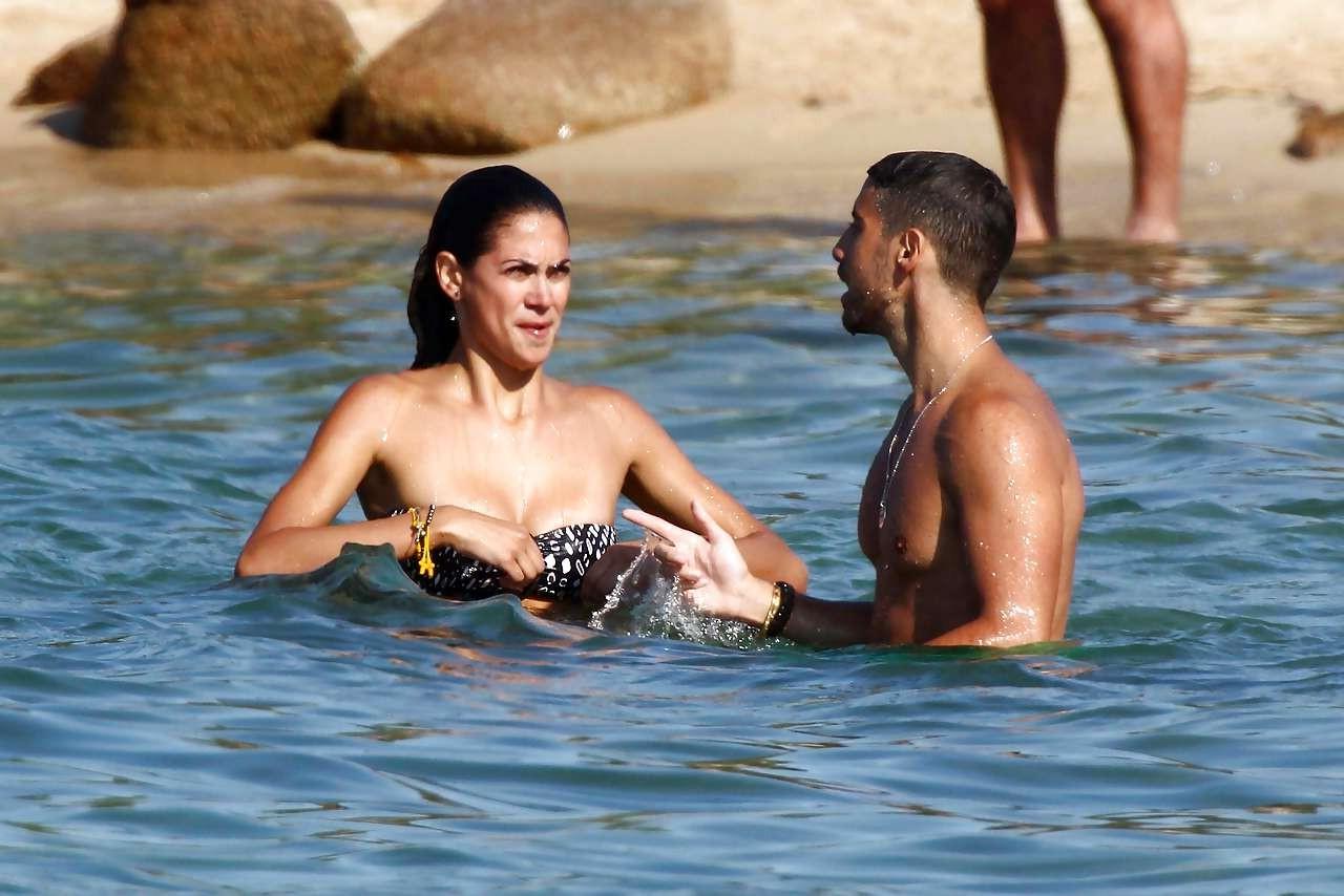 16P Melissa Satta showing her fantastic ass in thong bikini on beach paparazzi pictu