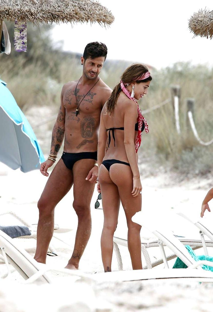 16P Belen Rodriguez showing her fantastic ass in black thong bikini on beach