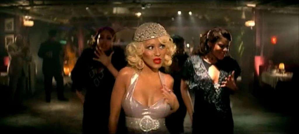 10P Christina Aguilera looking very hot in lingerie in her video spot and show tits 