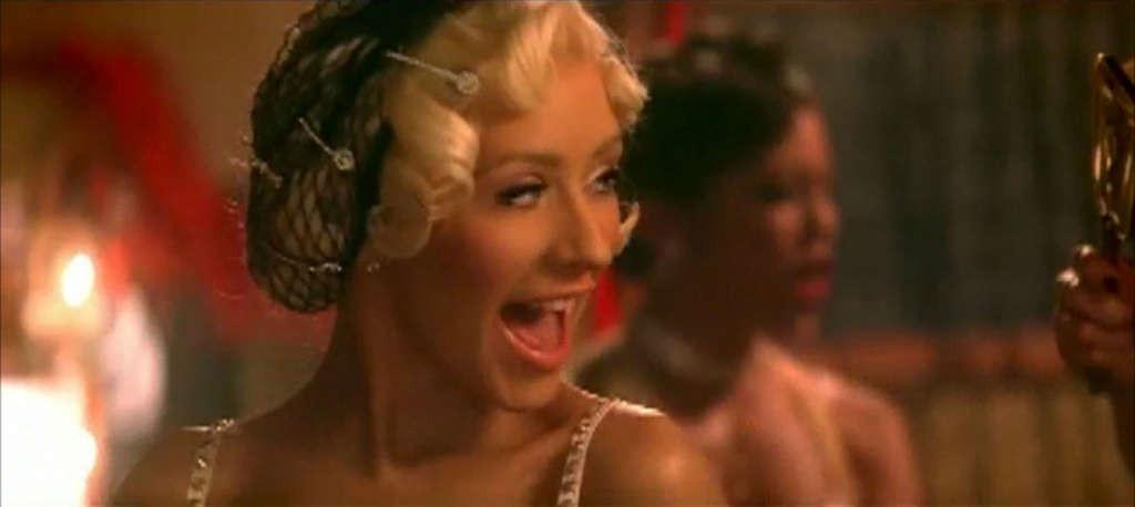 10P Christina Aguilera looking very hot in lingerie in her video spot and show tits 