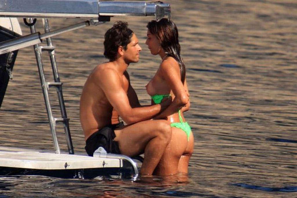 10P Belen Rodriguez showing her big tits and her ass in thong on beach