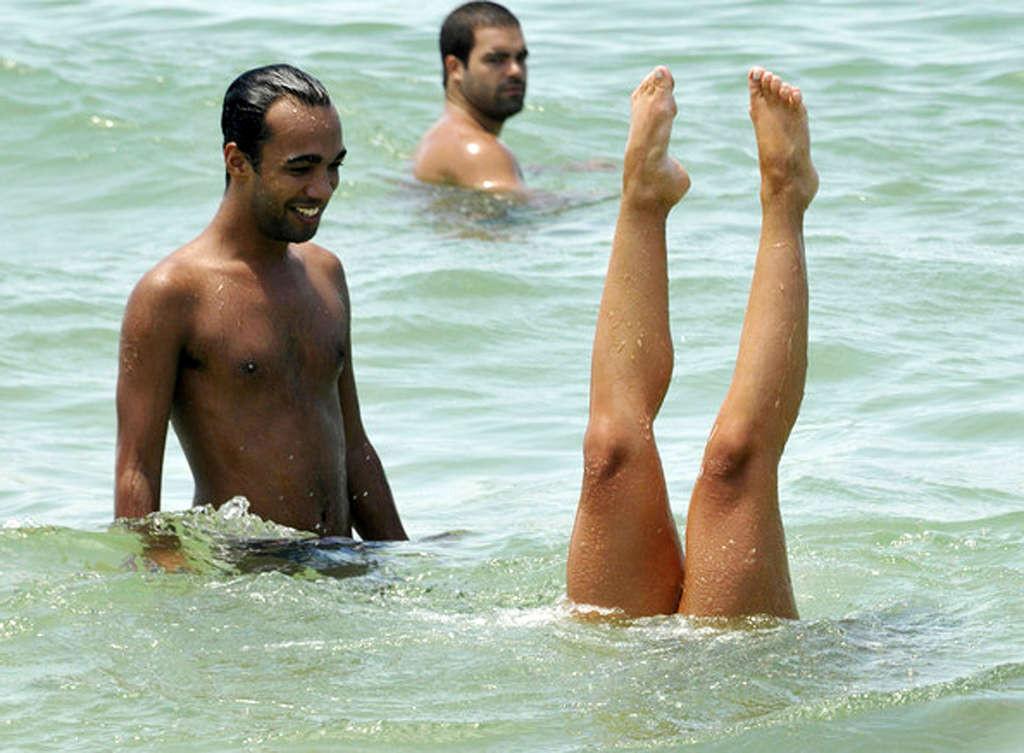 16P Nicole Bahls showing nice body and sexy ass in thong on beach