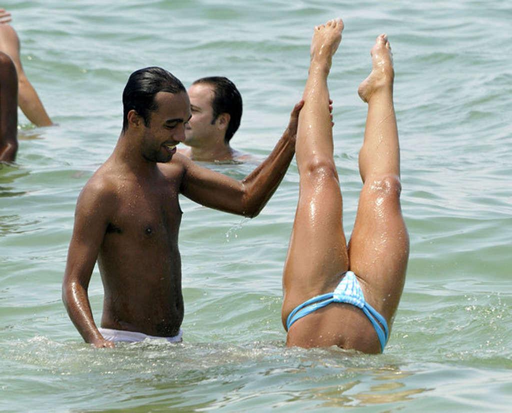 16P Nicole Bahls showing nice body and sexy ass in thong on beach