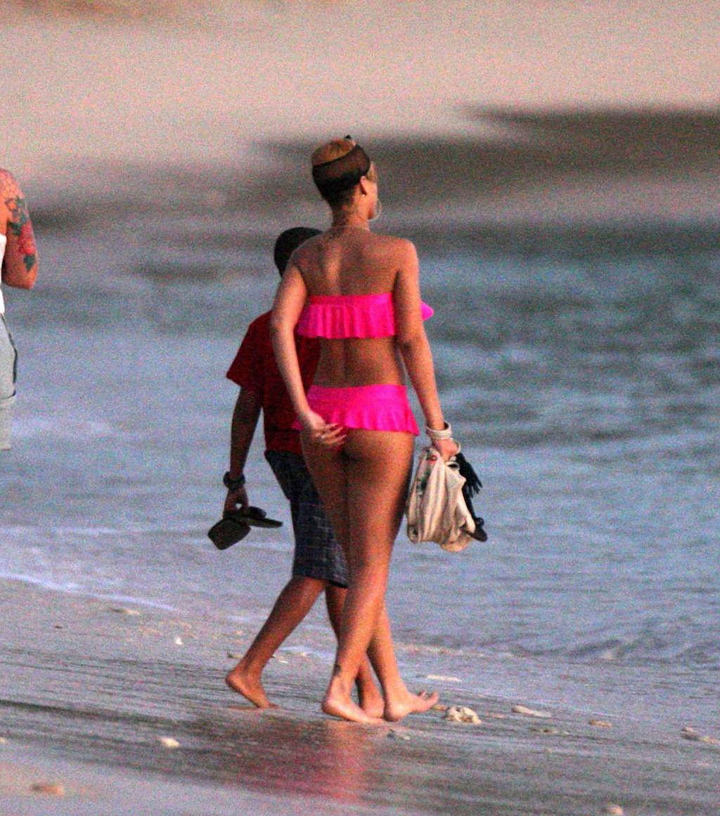 10P Rihanna looking sexy in red bikini and exposing her nice ass in thong and her bi