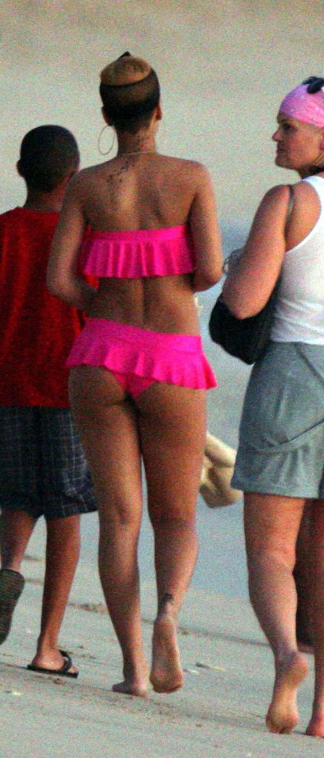 10P Rihanna looking sexy in red bikini and exposing her nice ass in thong and her bi