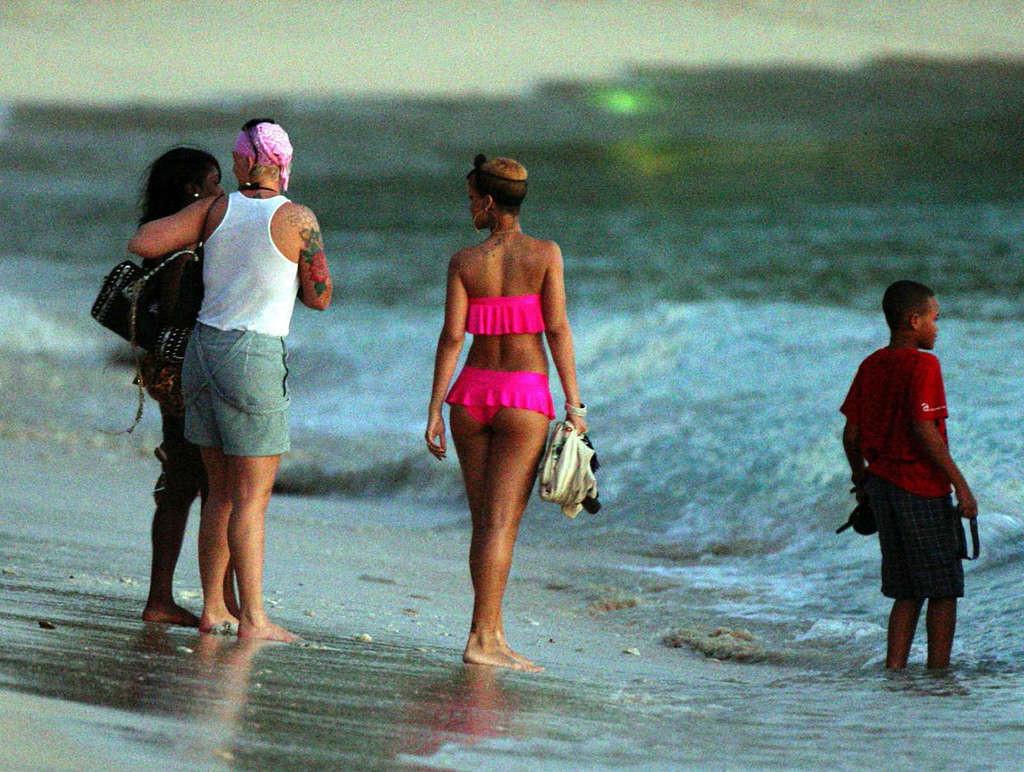 10P Rihanna looking sexy in red bikini and exposing her nice ass in thong and her bi