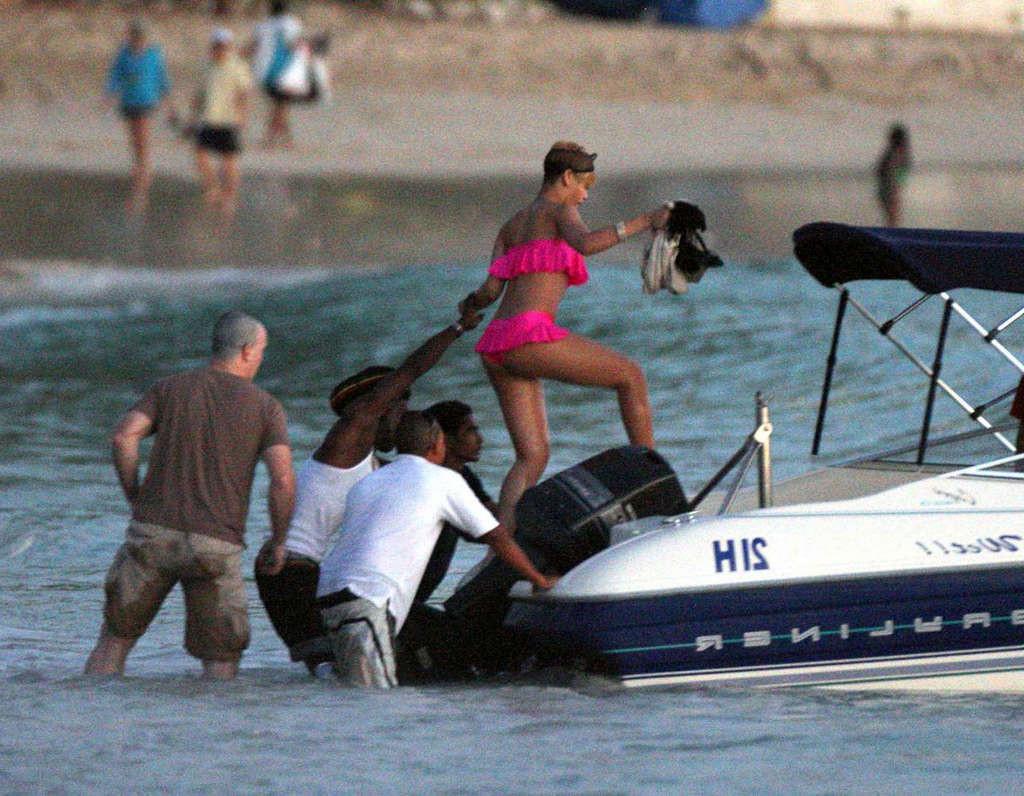 10P Rihanna looking sexy in red bikini and exposing her nice ass in thong and her bi