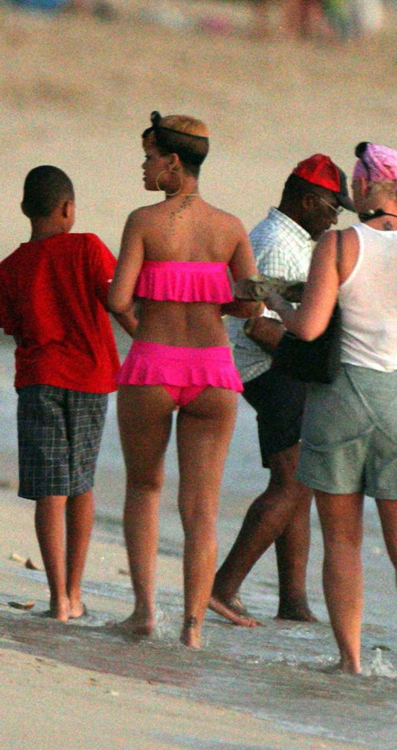 10P Rihanna looking sexy in red bikini and exposing her nice ass in thong and her bi