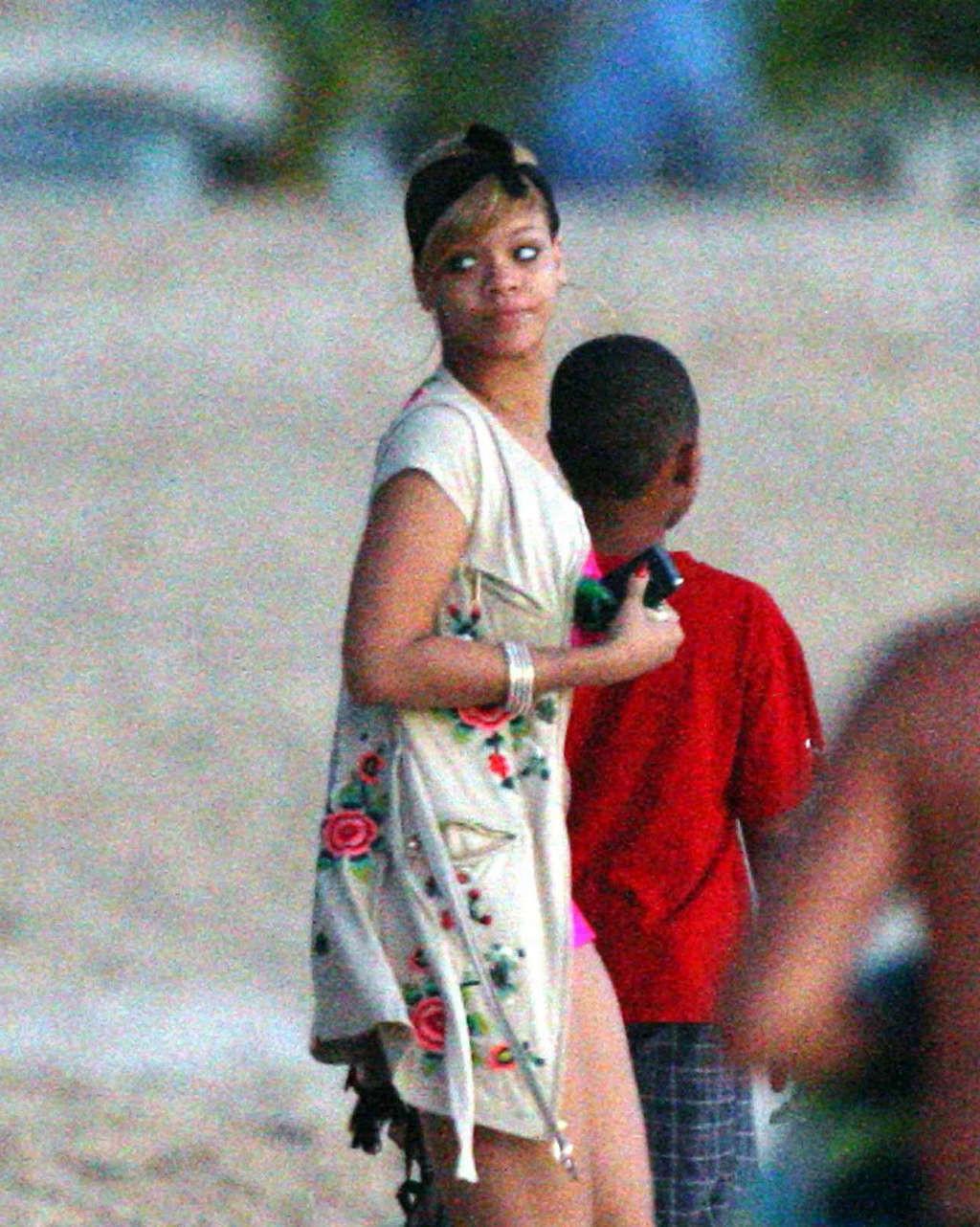 10P Rihanna looking sexy in red bikini and exposing her nice ass in thong and her bi