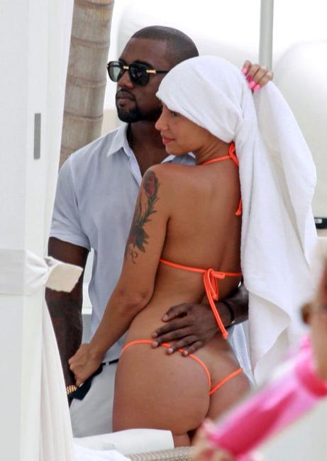 15P Amber Rose exposing marble ass in thong bikini