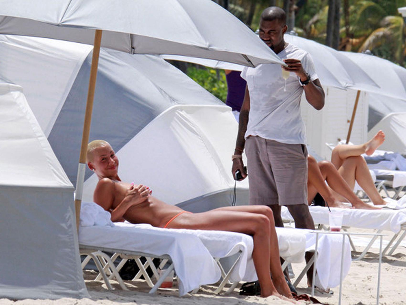 16P Amber Rose enjoying on beach in topless and showing sexy ass in thong