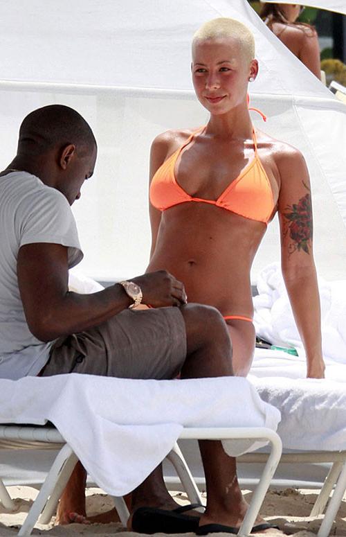 10P Amber Rose exposing her nice and big tits and great ass in thong paparazzi pictu