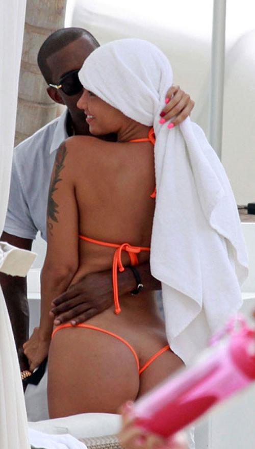 10P Amber Rose exposing her nice and big tits and great ass in thong paparazzi pictu