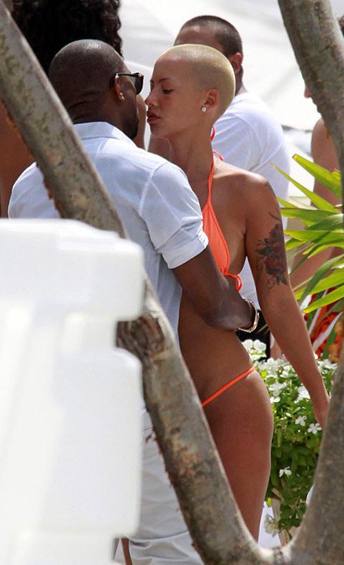 10P Amber Rose exposing her nice and big tits and great ass in thong paparazzi pictu