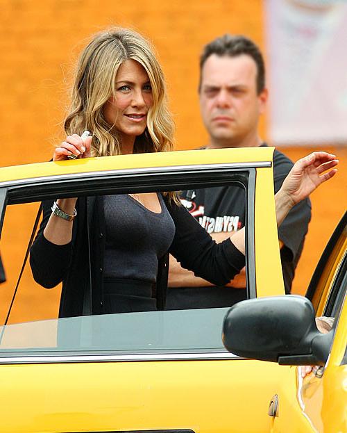 16P Jennifer Aniston showing her great ass in thong and her nice legs in mini skirt