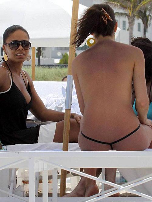 10P Sanaa Lathan showing her tits and ass in thong on beach paparazzi pictures