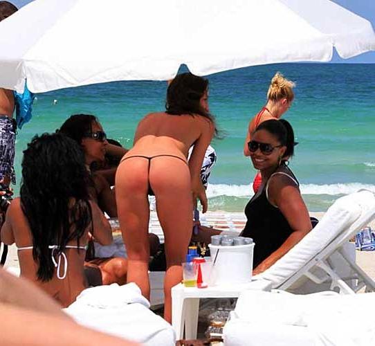 10P Sanaa Lathan showing her tits and ass in thong on beach paparazzi pictures