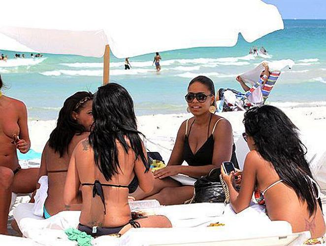 10P Sanaa Lathan showing her tits and ass in thong on beach paparazzi pictures