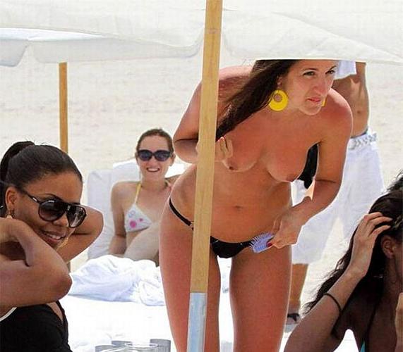 10P Sanaa Lathan showing her tits and ass in thong on beach paparazzi pictures