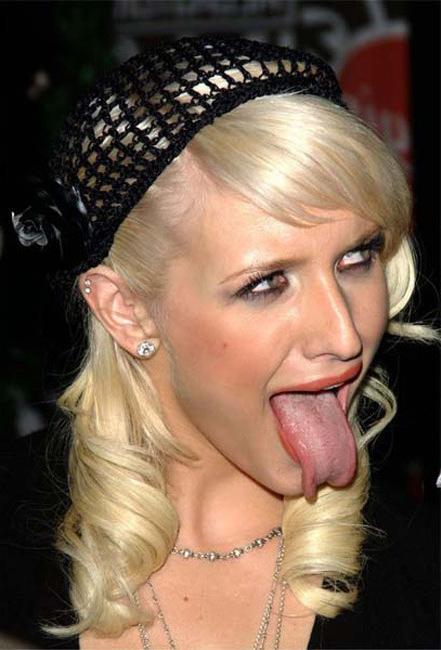 15P Ashlee Simpson large tongue and pose in bikini