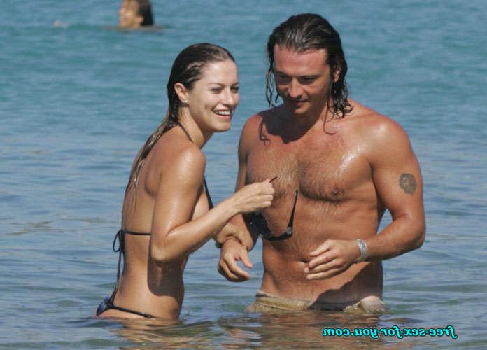 16P Lola Ponce posing sexy in a thong and in bikini on beach