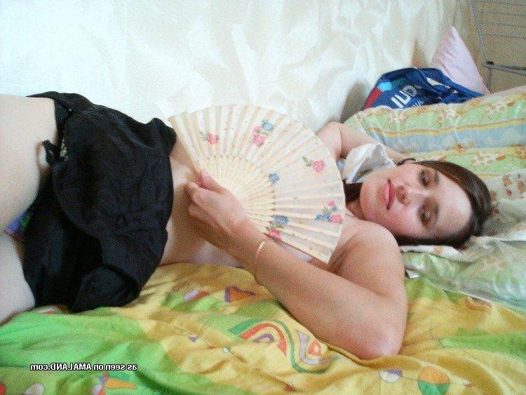 10P Collection of a sexy brunette MILF posing on her bed