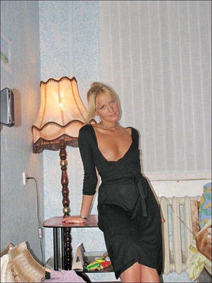 18P Hot blonde MILF gets naked and experiments with different naughty poses inside h