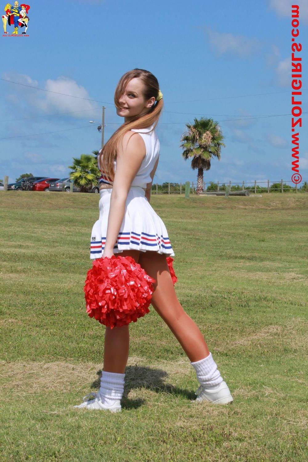 15P Cute cheerleader posing outside in her pantyhose