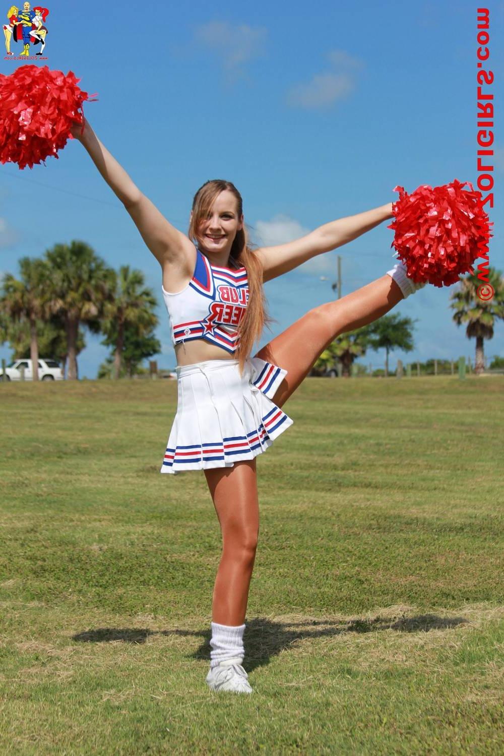 15P Cute cheerleader posing outside in her pantyhose