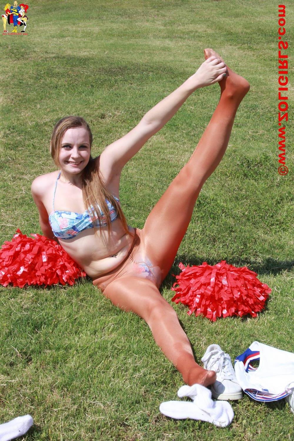 15P Cute cheerleader posing outside in her pantyhose