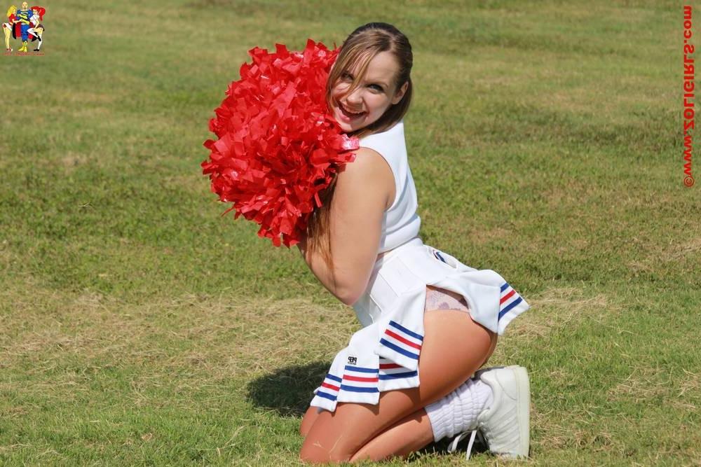 15P Cute cheerleader posing outside in her pantyhose