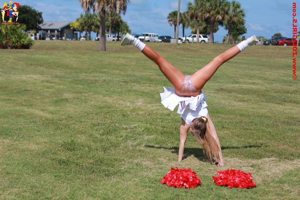 15P Cute cheerleader posing outside in her pantyhose