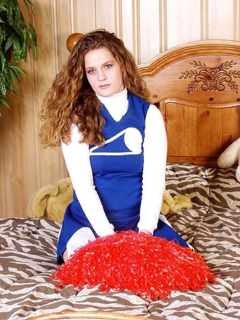 13P Curly Cheerleader showing her perky boobies