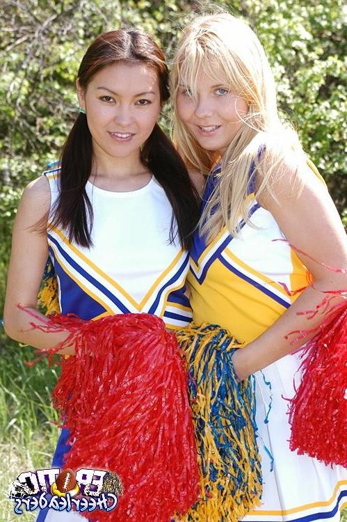15P Two erotic cheerleaders licking their pussies outdoors