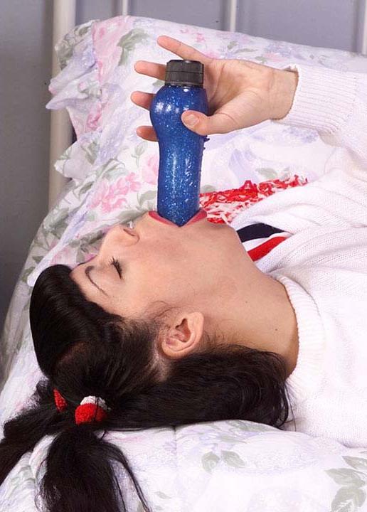 15P Pigtailed cheerleader Felice sucking a fat dildo with lust