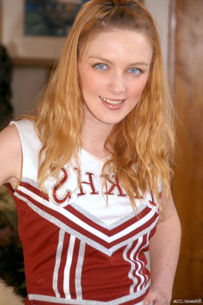 19P Petite redhead cheerleader strips and shows fire crotch