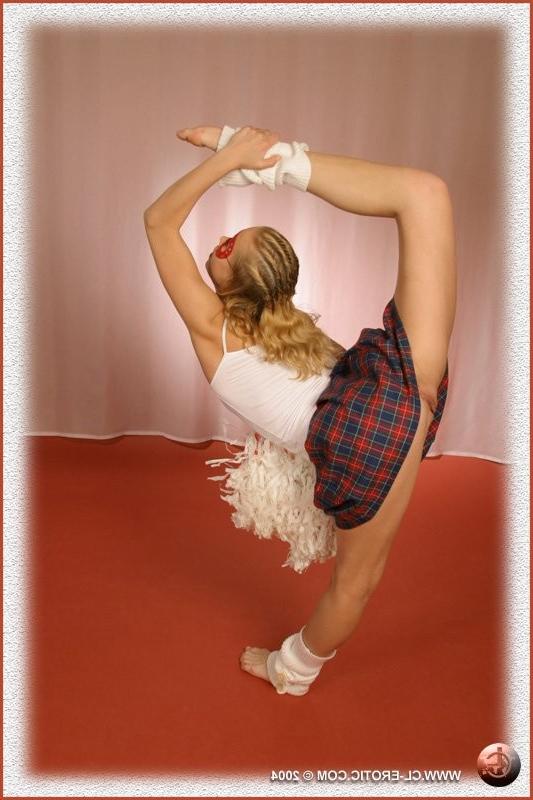 16P Contortionist spreads in a cheerleader outfit
