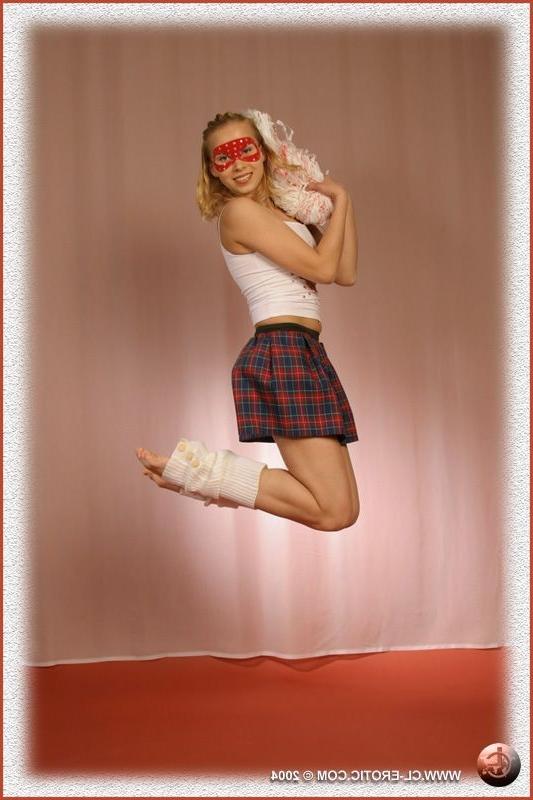 16P Contortionist spreads in a cheerleader outfit