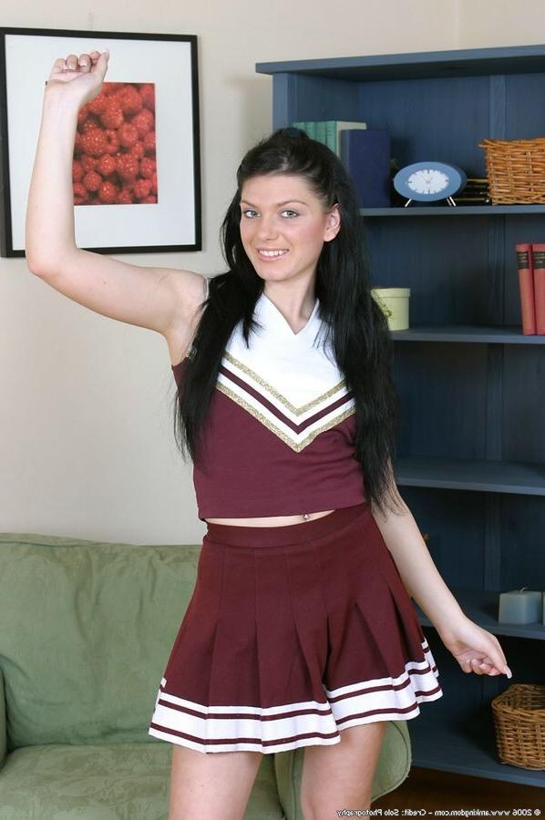 15P Cheerleader pulls her hairless pussy lips open