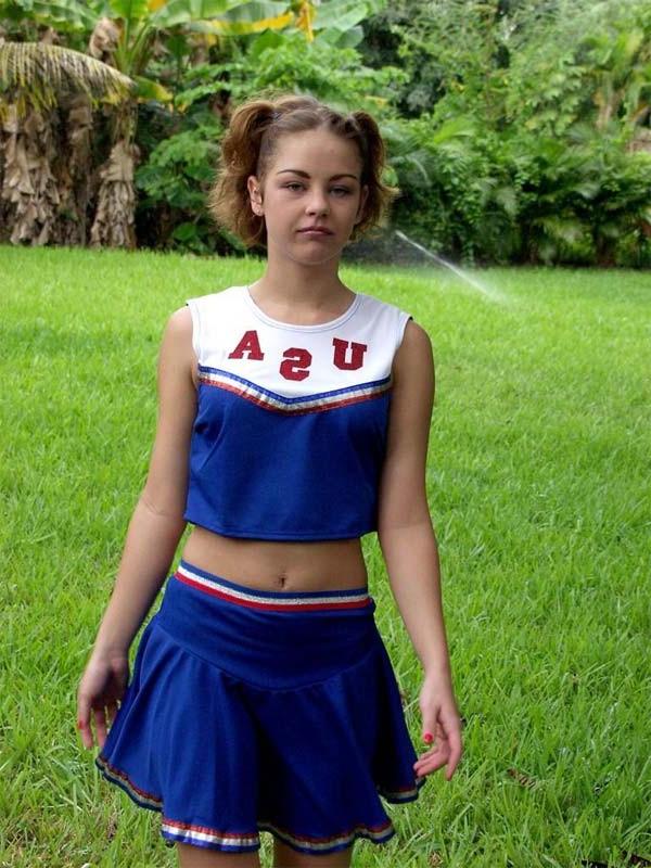 20P Horny amateur teen cheerleader loves strip teasing outdoors