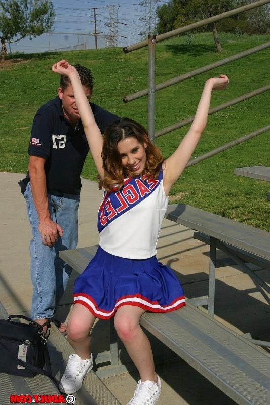 20P Hot Brunette Cheerleader Gives Two Guys A Blowjob