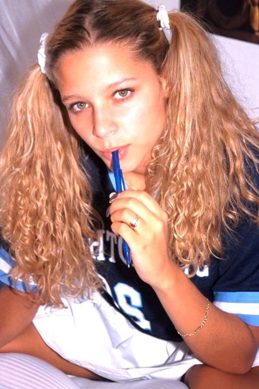 16P Young big tit schoolgirl posing in her cheerleader uniform