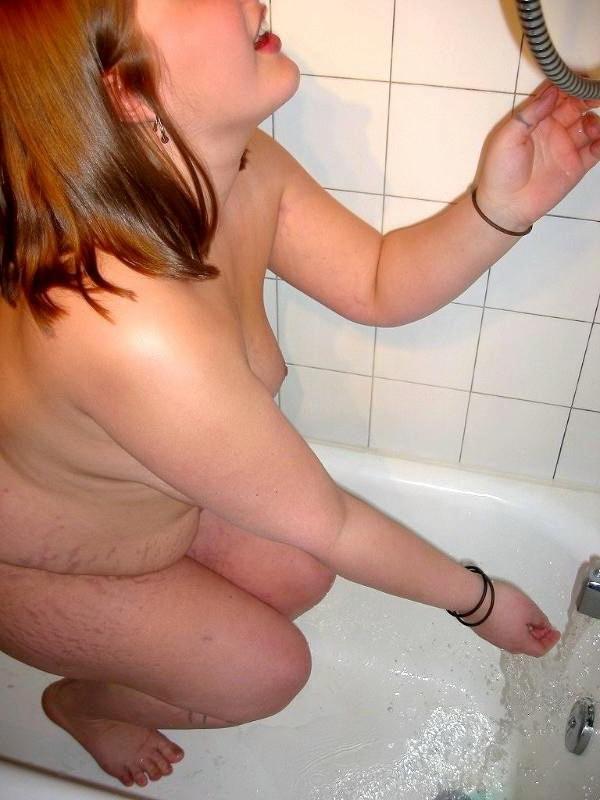 16P Naughty fat amateur taking a shower and washing her pussy