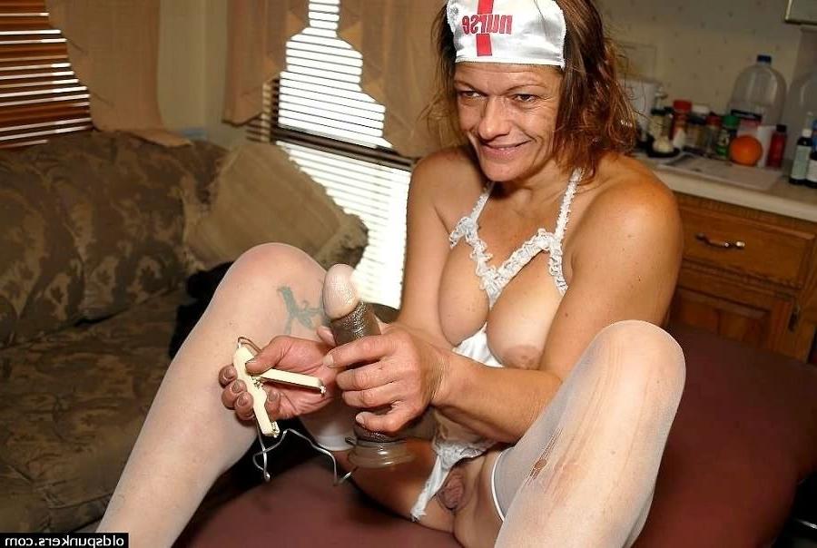 16P Kinky mature plumper in nurse uniform teasing and playing a dildo