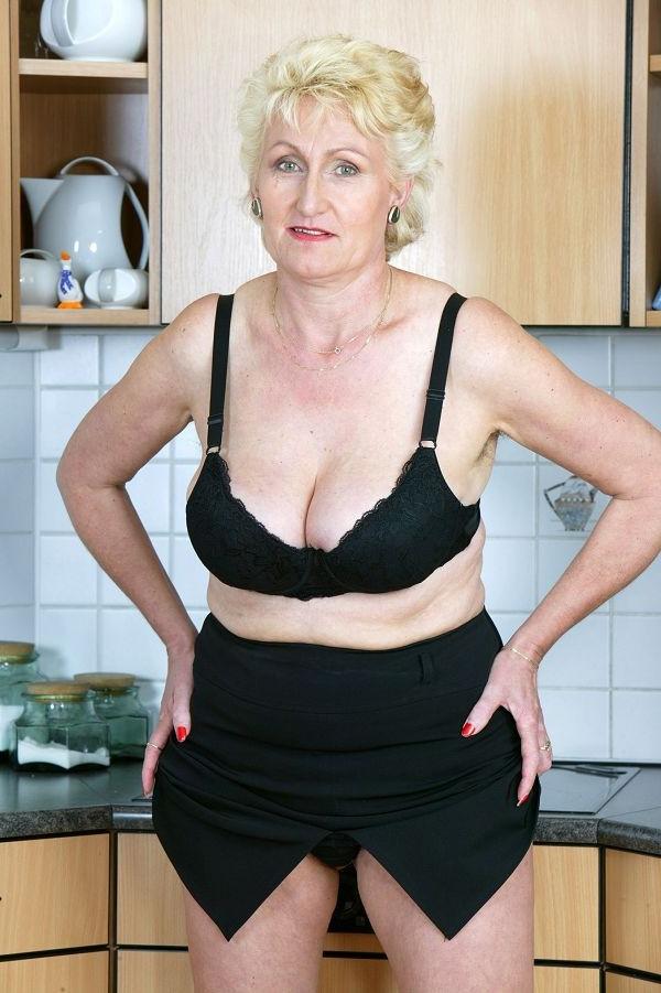 16P Big titted grandma with curvy hips gets undressed